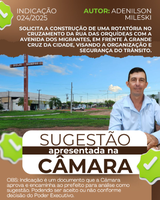 Vereador Adenilson Mileski solicita a construção de uma rotatória no cruzamento da Rua das Orquídeas com a Avenida dos Migrantes, em frente à grande cruz da cidade, visando a organização e segurança do trânsito.